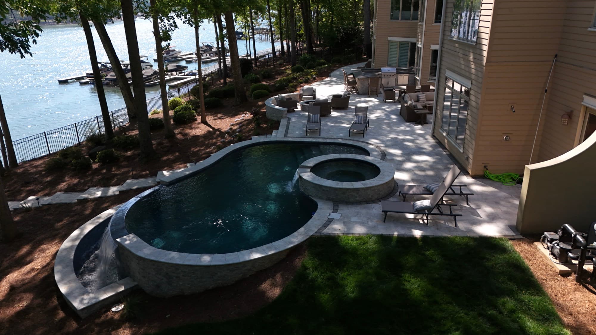 Real estate aerial of a luxury lakefront property and custom pool by SQO SkyWorks, Charlotte NC