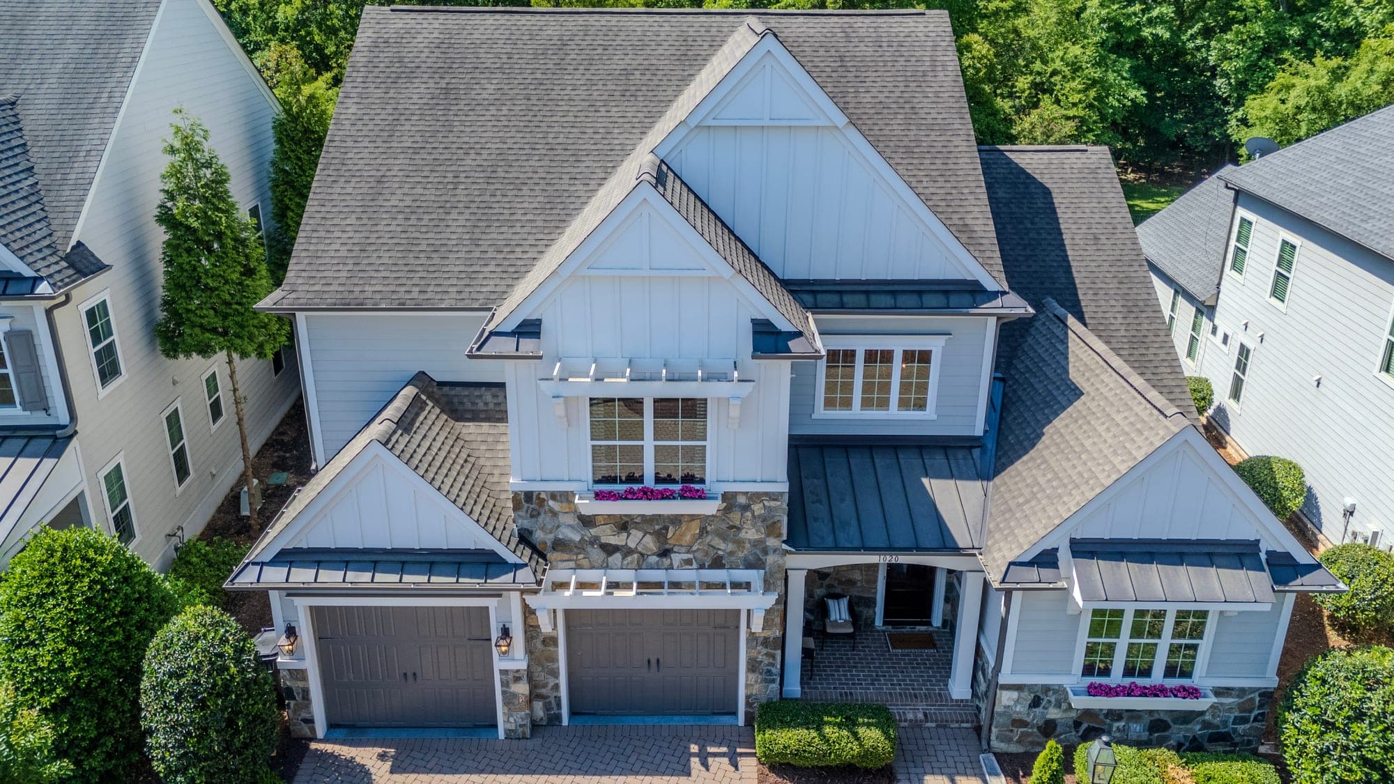 Aerial drone photo of a custom luxury home and its architecture