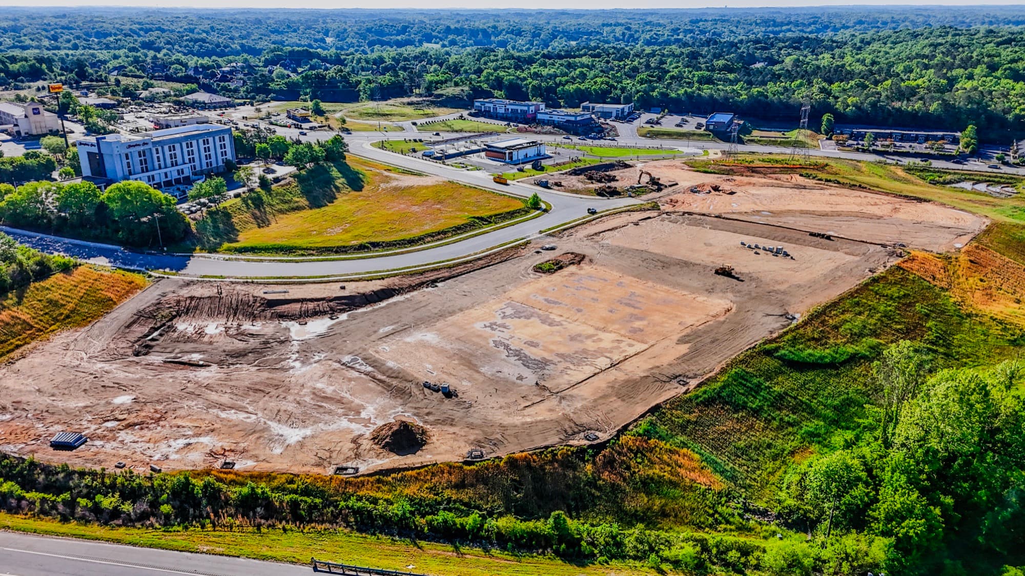 Construction progress aerial of a graded building pad mid-build by SQO SkyWorks, Charlotte NC